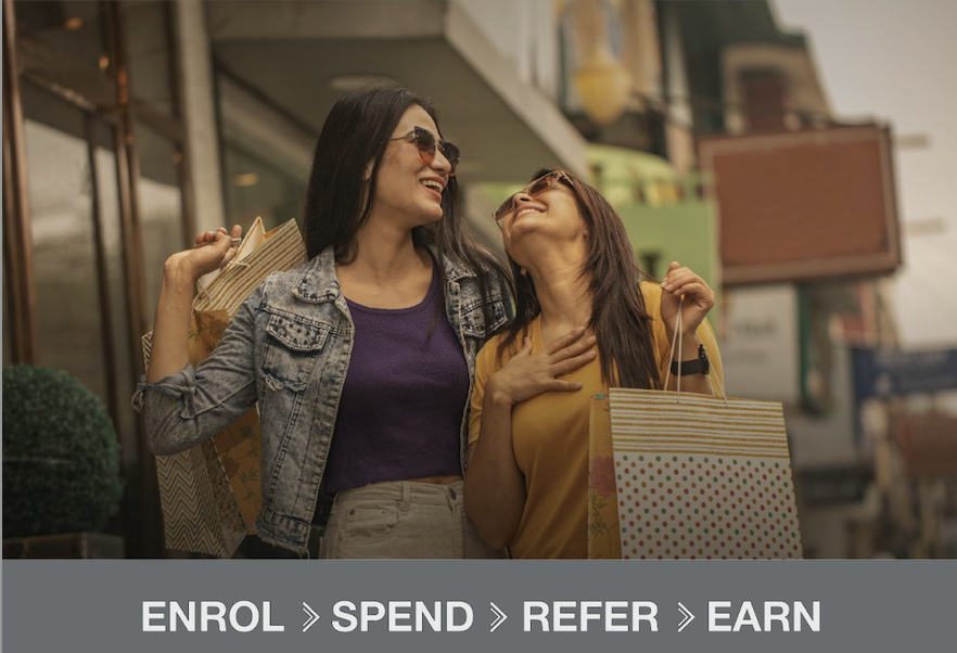 two women holding shopping bags